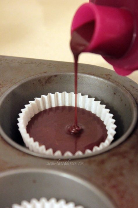 Pouring batter with a Tupperware cup with lid